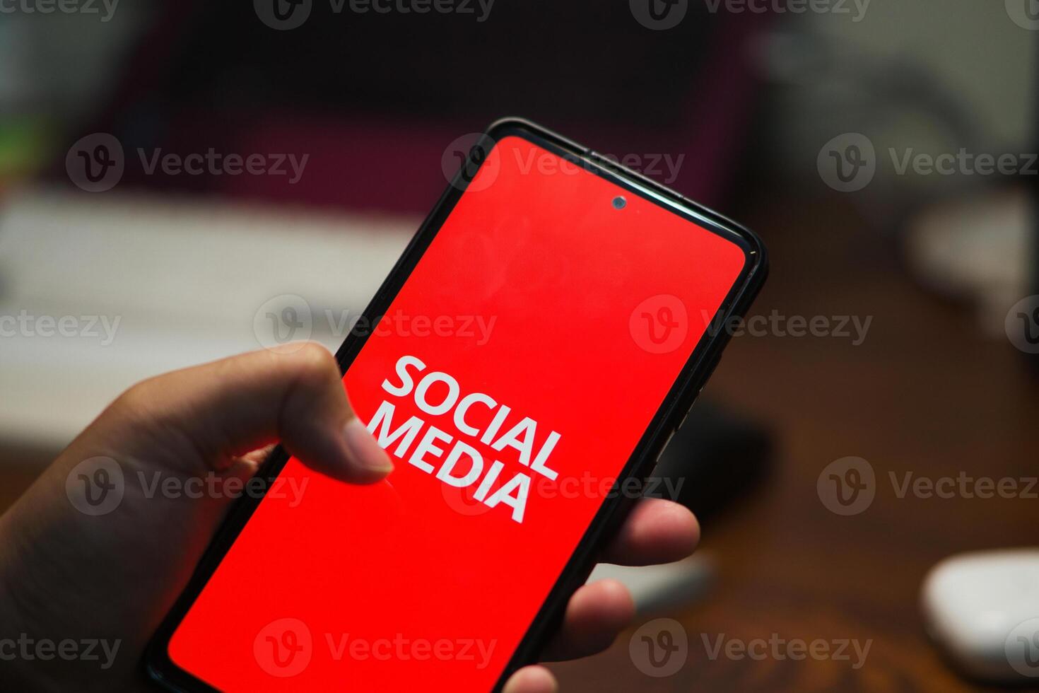 Concept of a Person's Hand Scrolling Through Social Media, Illustrating the Negative Impacts of Social and Internet photo