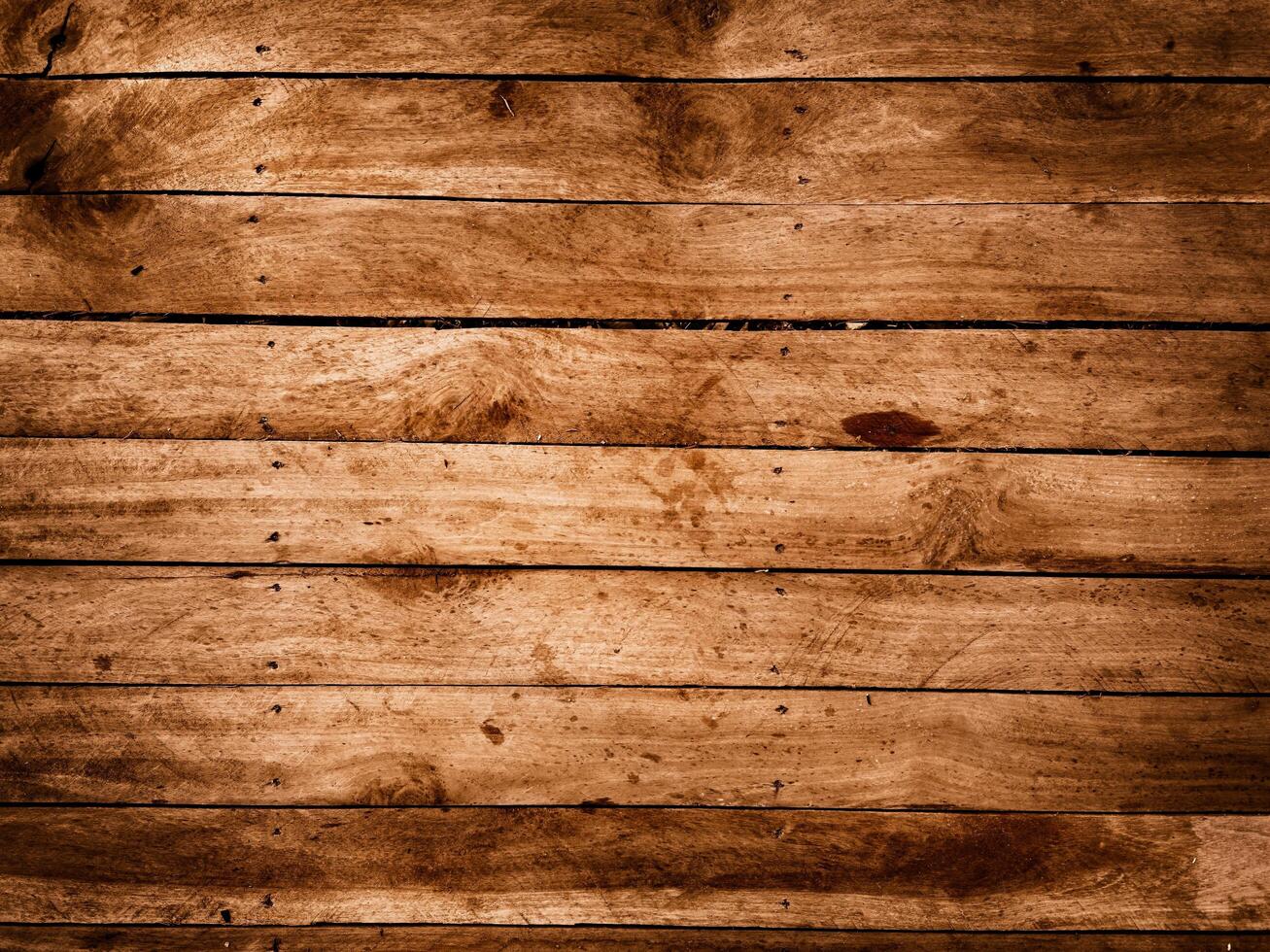 Weathered wooden planks with visible grain knots and nail heads create a rustic texture photo