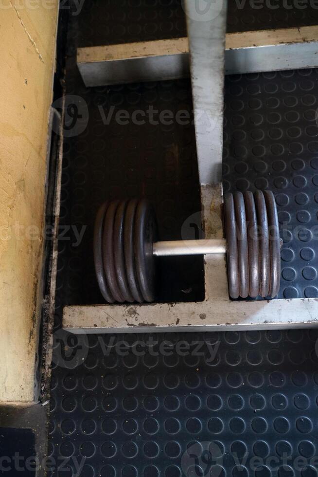 Close Up of a Barbell with Weights in a Gym photo