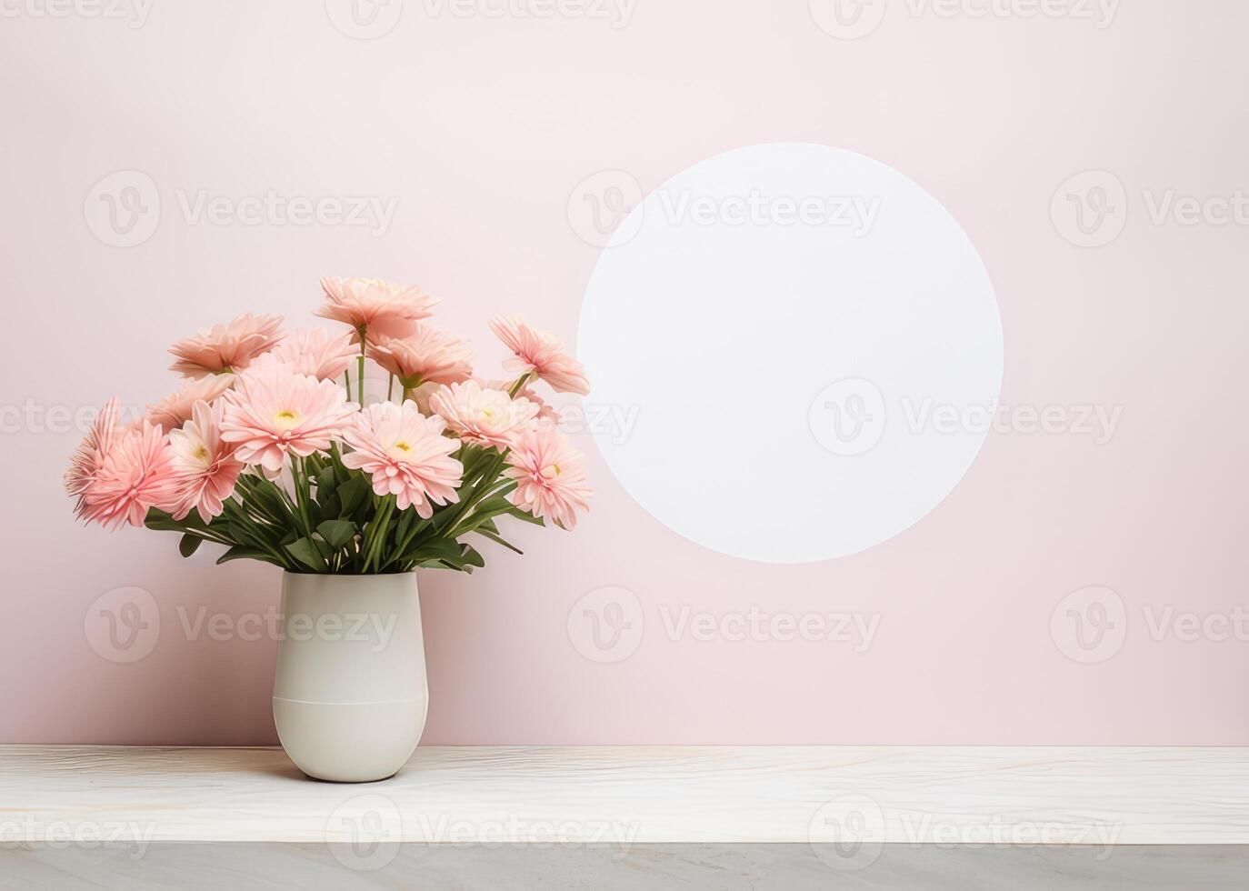 A vase of pink flowers sits on a table by a pink wall photo
