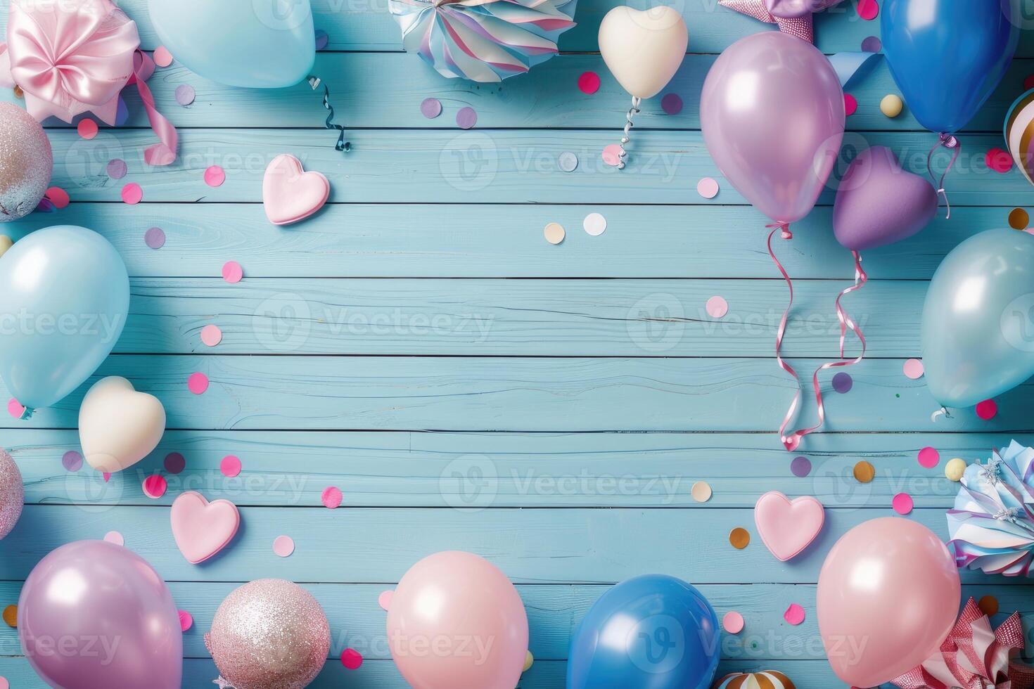 The wooden table is covered in colorful balloons and confetti photo