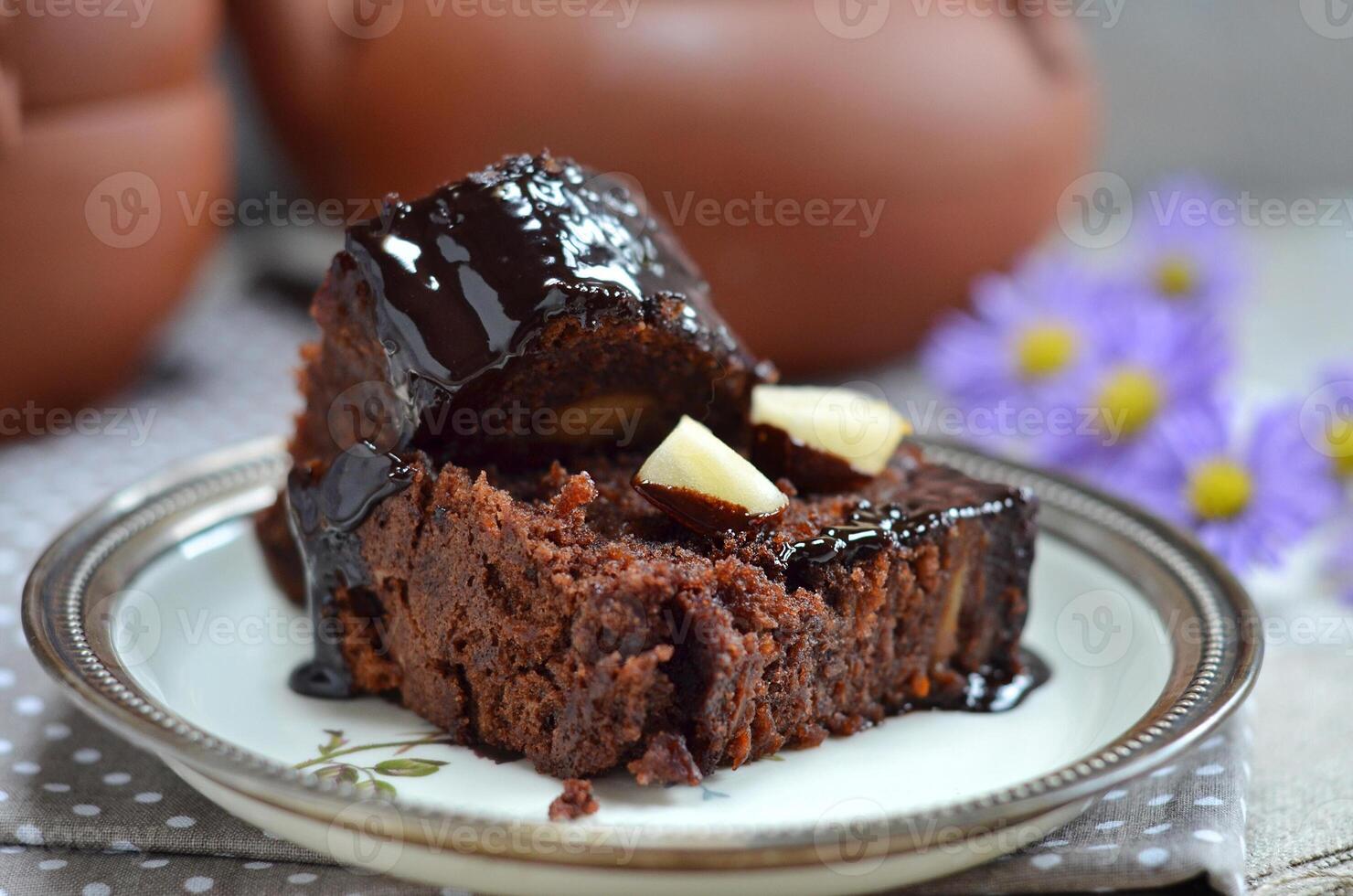 Chocolate cake slice with toppings photo