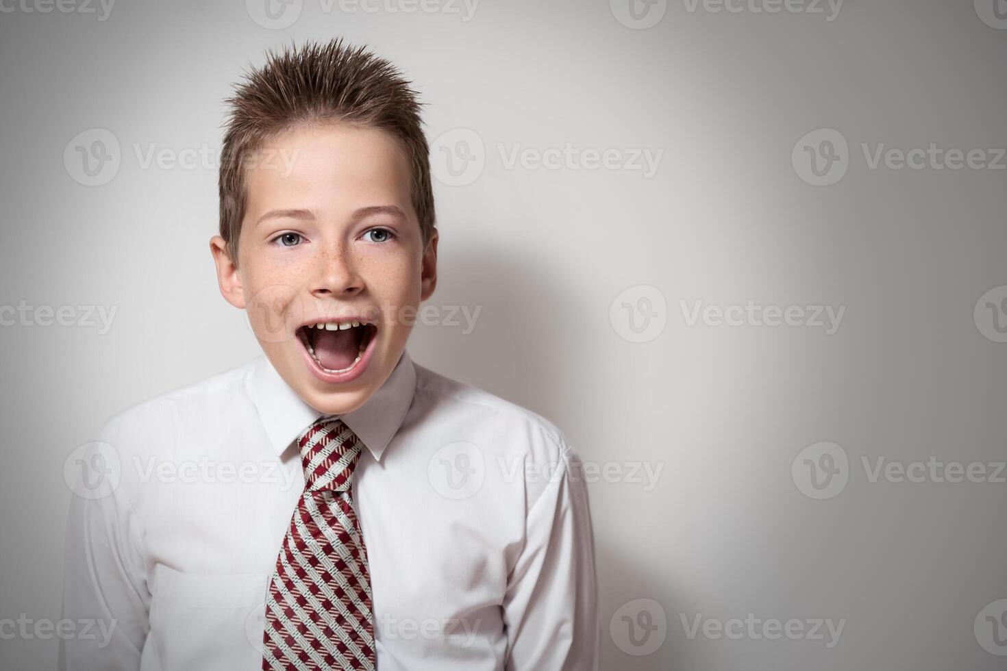Emotional portrait of cute screaming boy photo