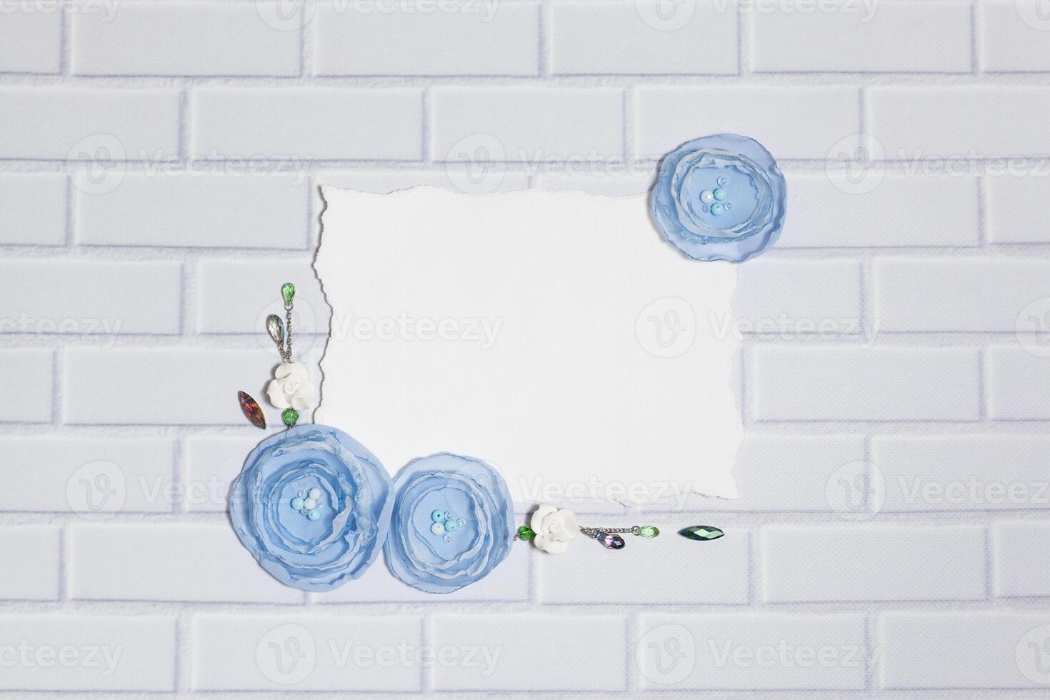 White Paper Background With Handmade Ranunculus Flowers photo