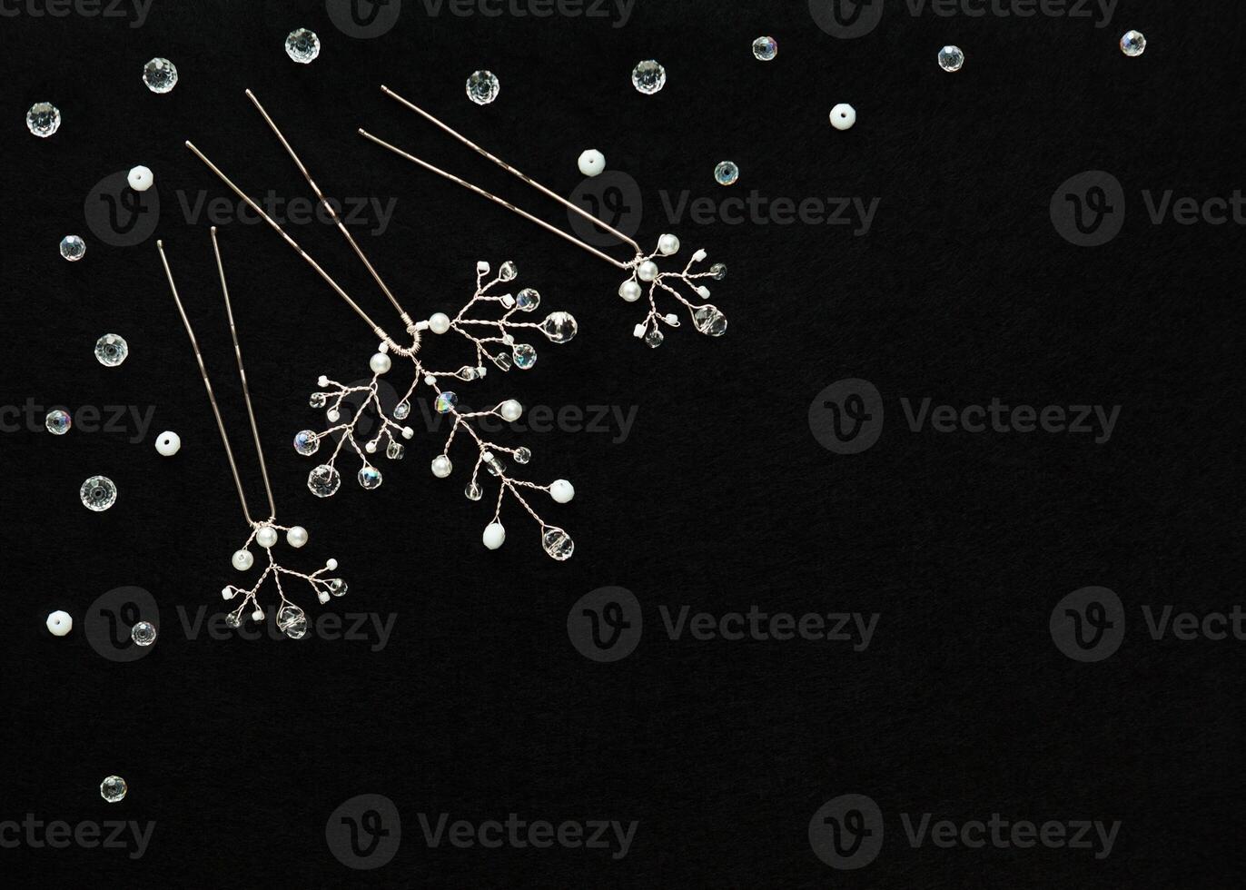 Handmade wedding crystal jewelry on the the black background photo