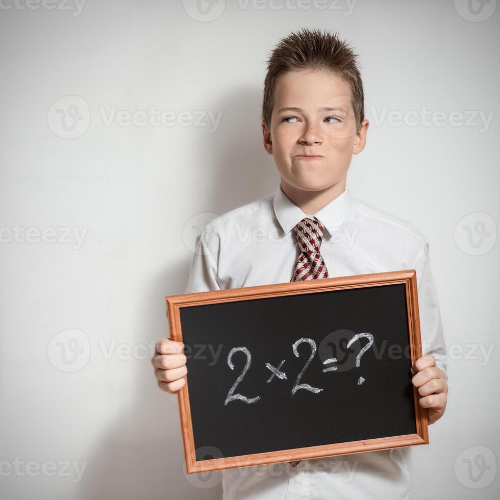 The schoolboy has thought of the task decision photo