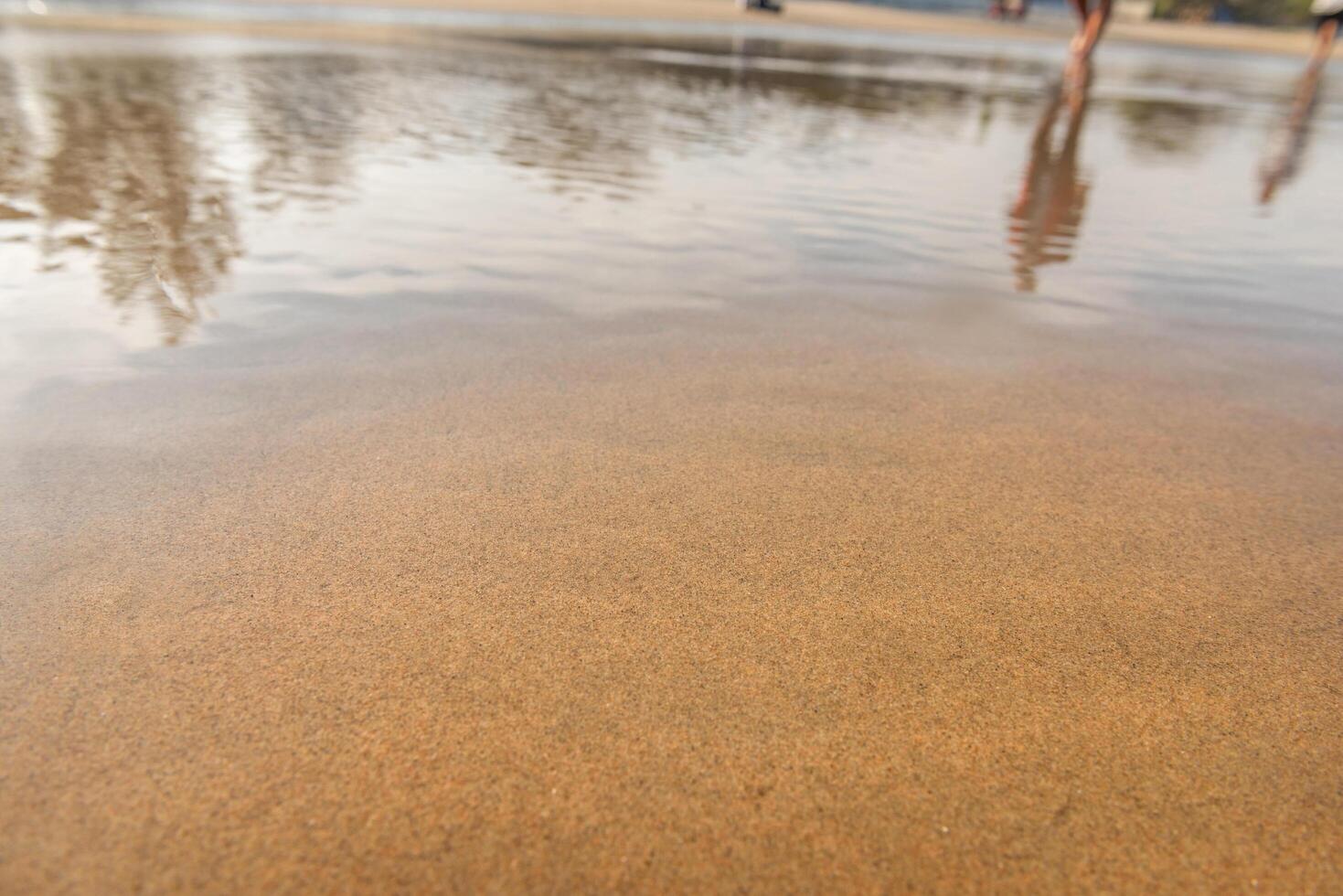 waves crash in the beach sand for background photo