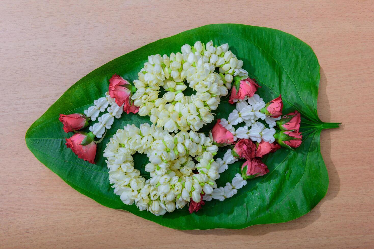 Thai traditional jasmine garland.symbol of Mother's day in thailand on leaf photo