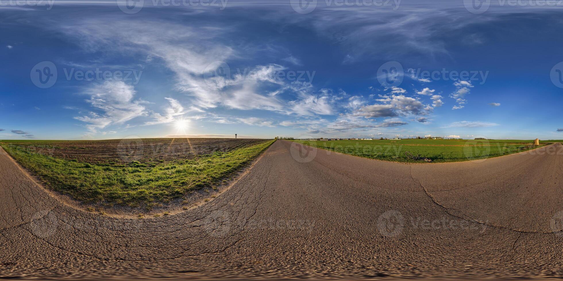 360 panorama of a road in the middle of a field photo