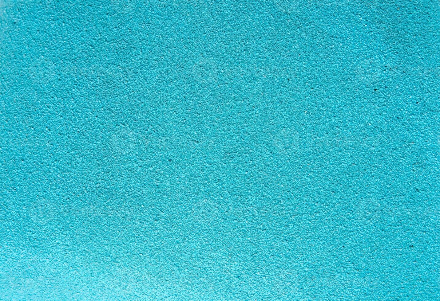 Bright turquoise textured surface, perfect for use as a background in design projects, presentations, templates, posters, or digital graphics with copy space. photo