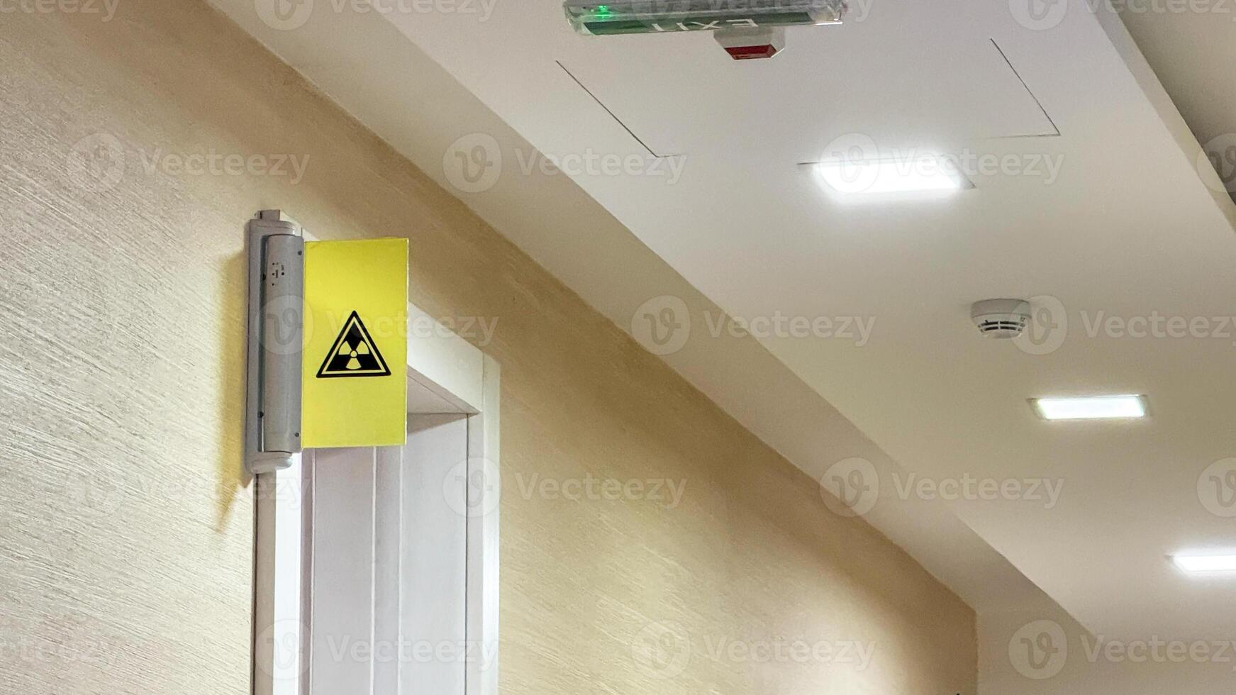 Illuminated corridor with a cryptic radiation sign, evoking Sci fi Day unease, safety protocol ambiance, secretive mystery vibe photo