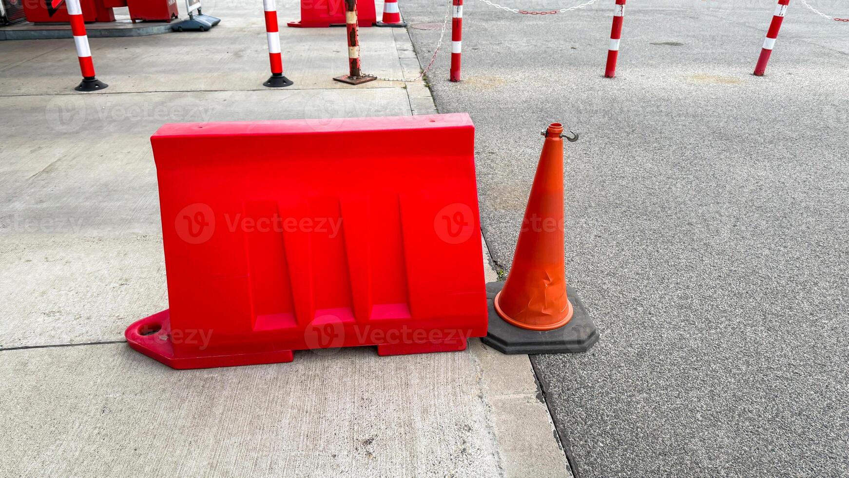 Red barricades contrast pavements grayscale for a parking odyssey think urban festivals or peculiar Barrier Awareness Day photo