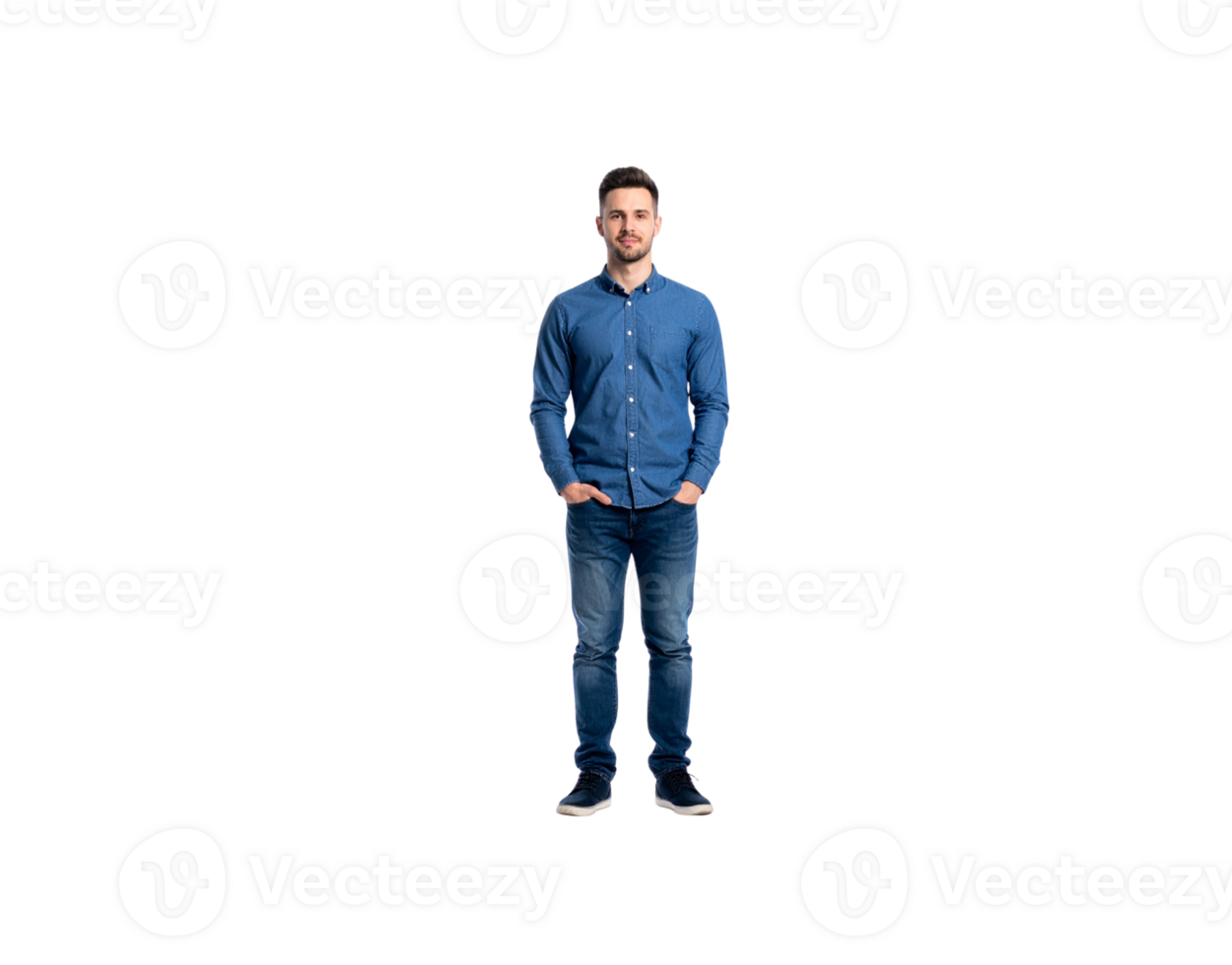Standing man in denim shirt and jeans with hands in pockets. png