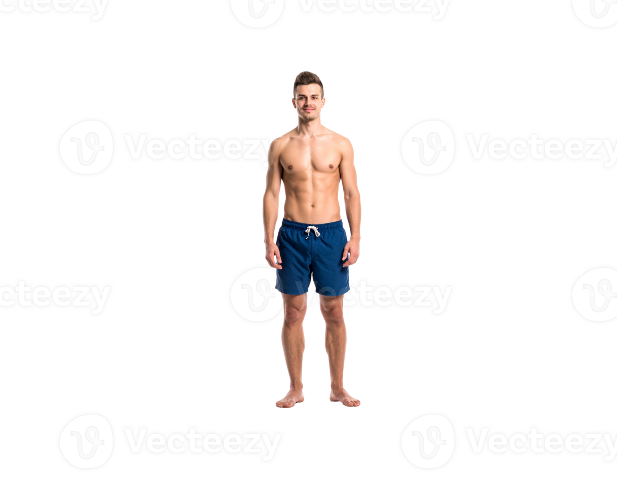 Fit Caucasian man in blue swim trunks standing barefoot smiling slightly. png