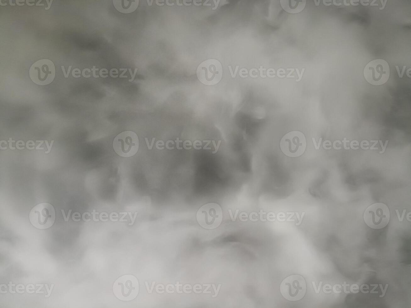 Grey smoke and white fog form an abstract background texture. dark atmosphere feels ethereal with swirling pattern of mysterious steam and misty vapor effect photo