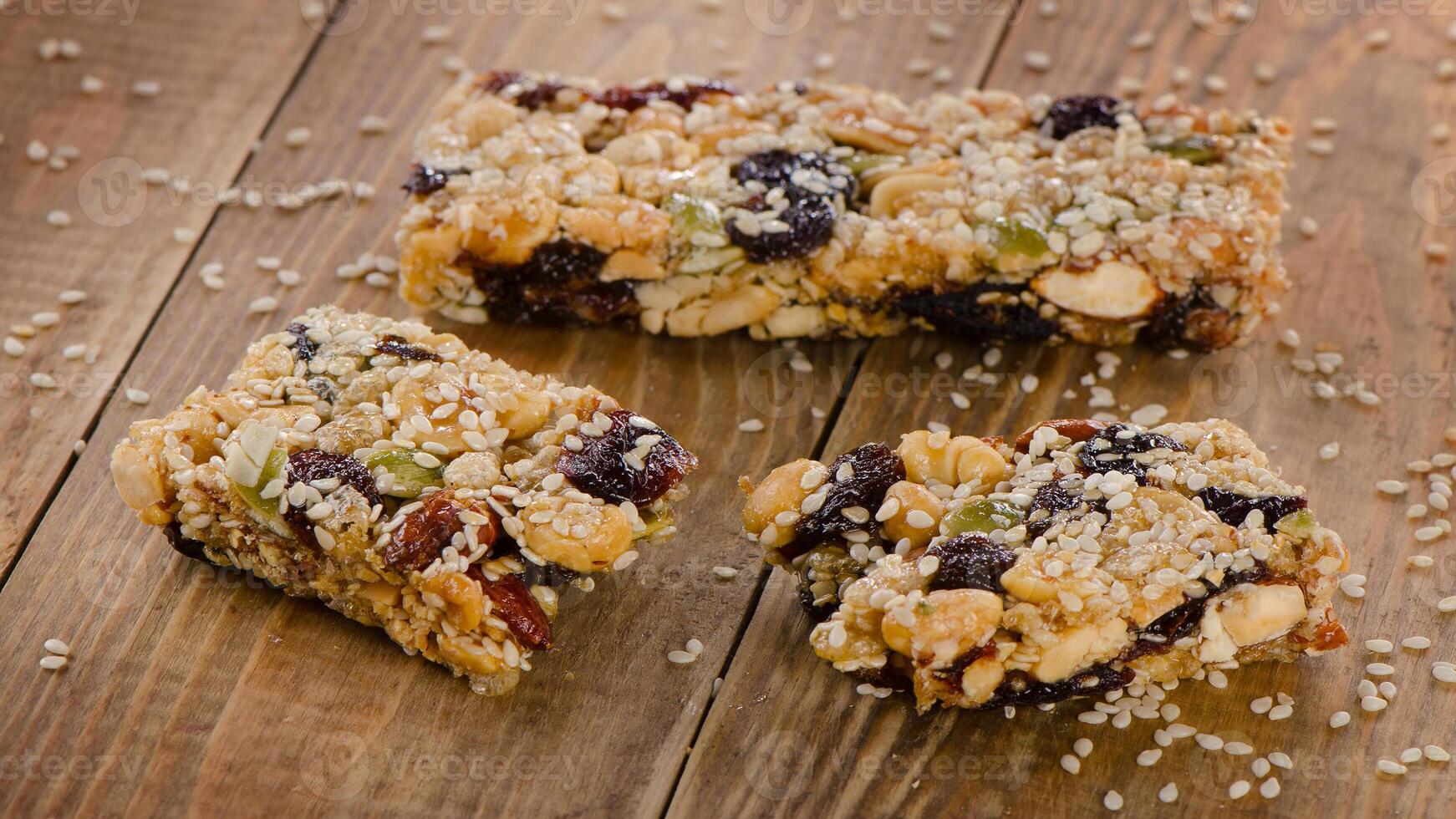 A close up of some granola bars on a wooden table photo
