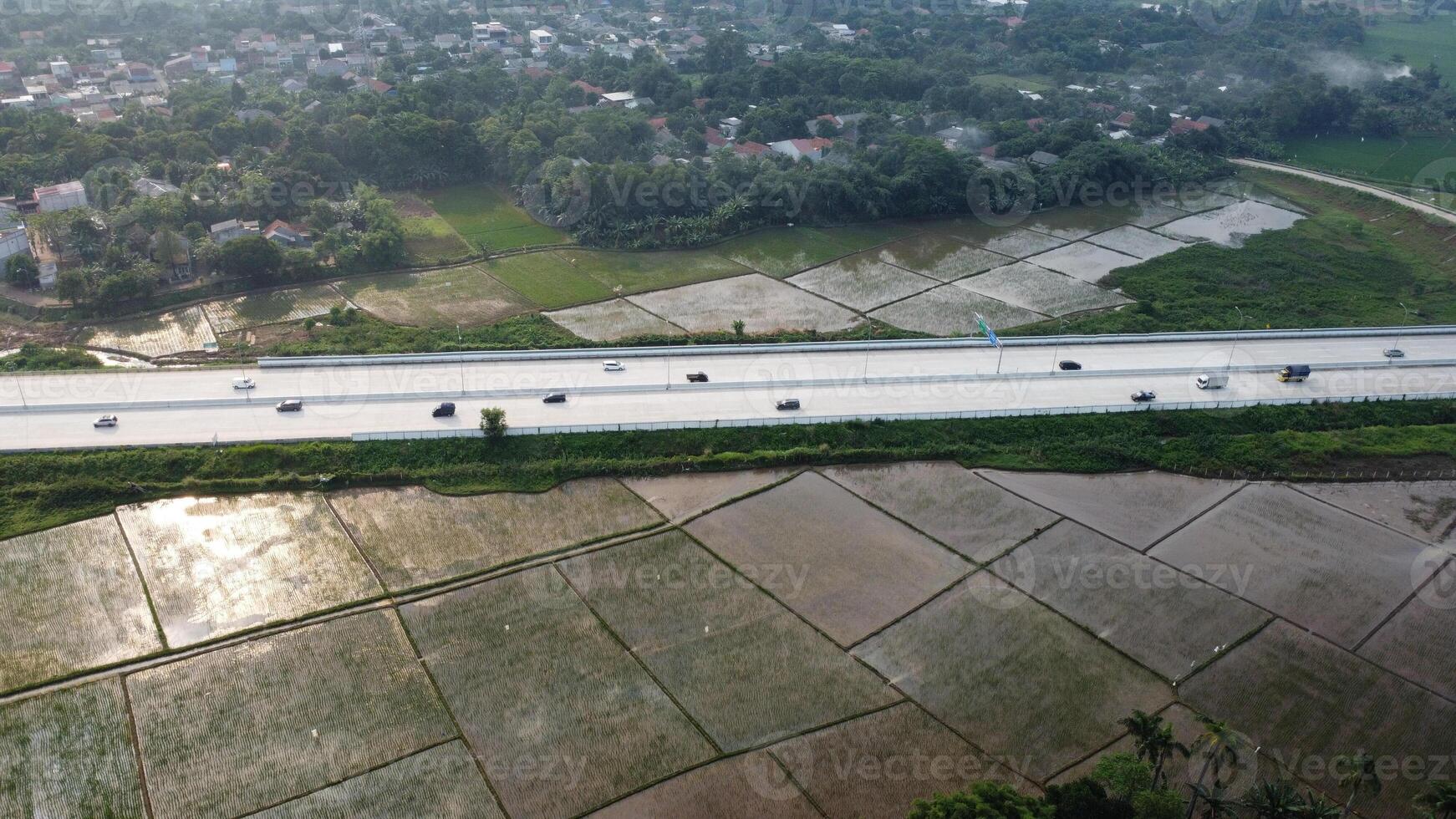An aerial view of a highway with cars driving on it photo