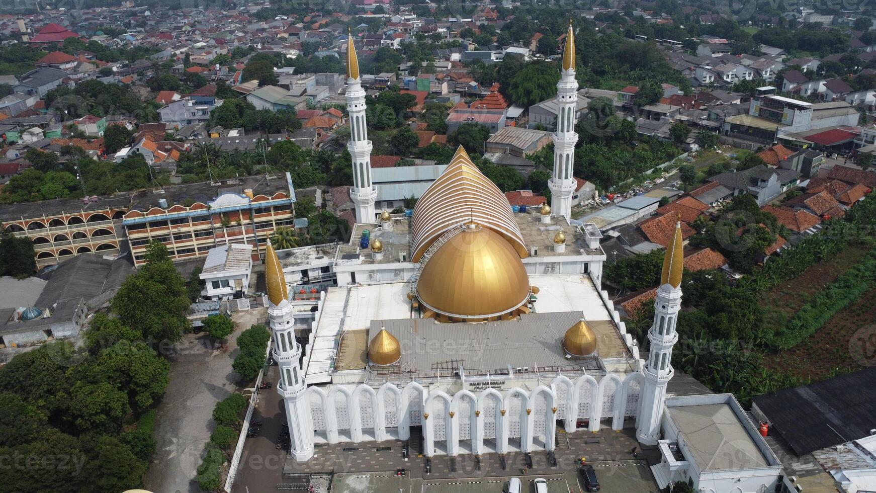 An aerial view of a white and gold mosque photo