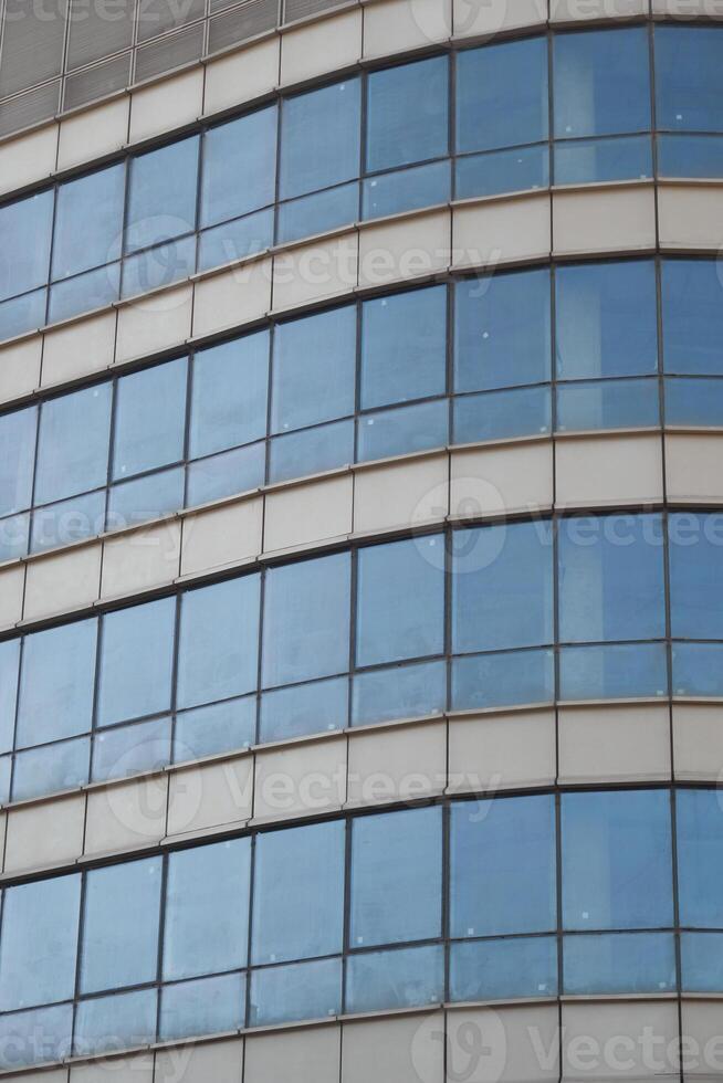 Modern office building with curved glass facade photo