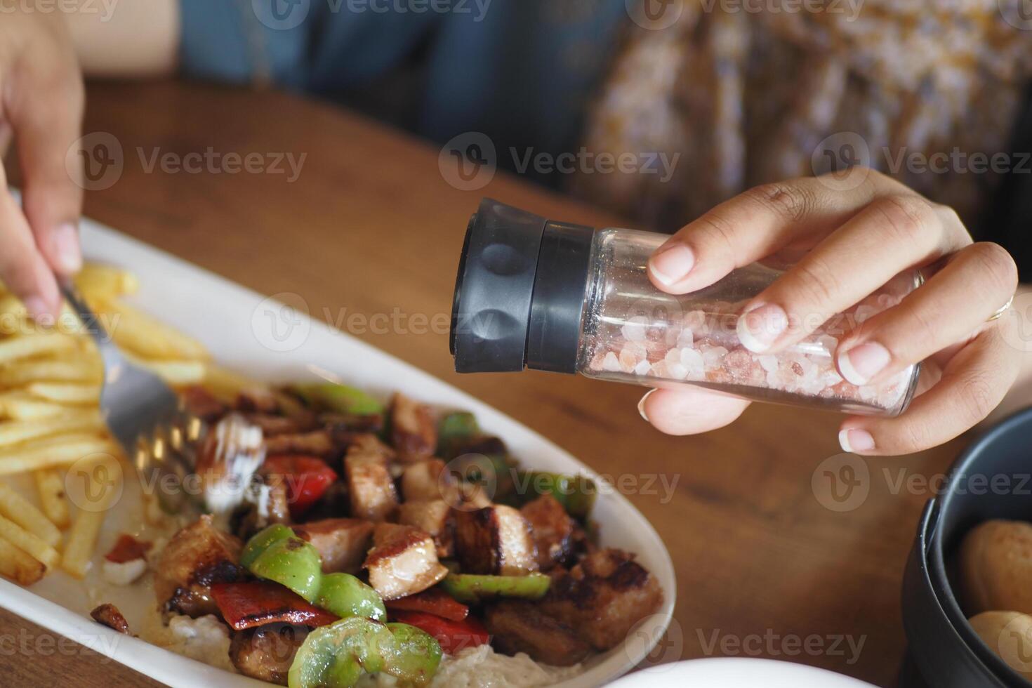 Enjoying flavorful meal with seasoned meat and vegetables photo