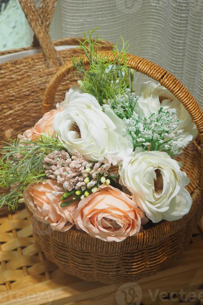 Beautiful floral arrangement in a wicker basket for decor photo