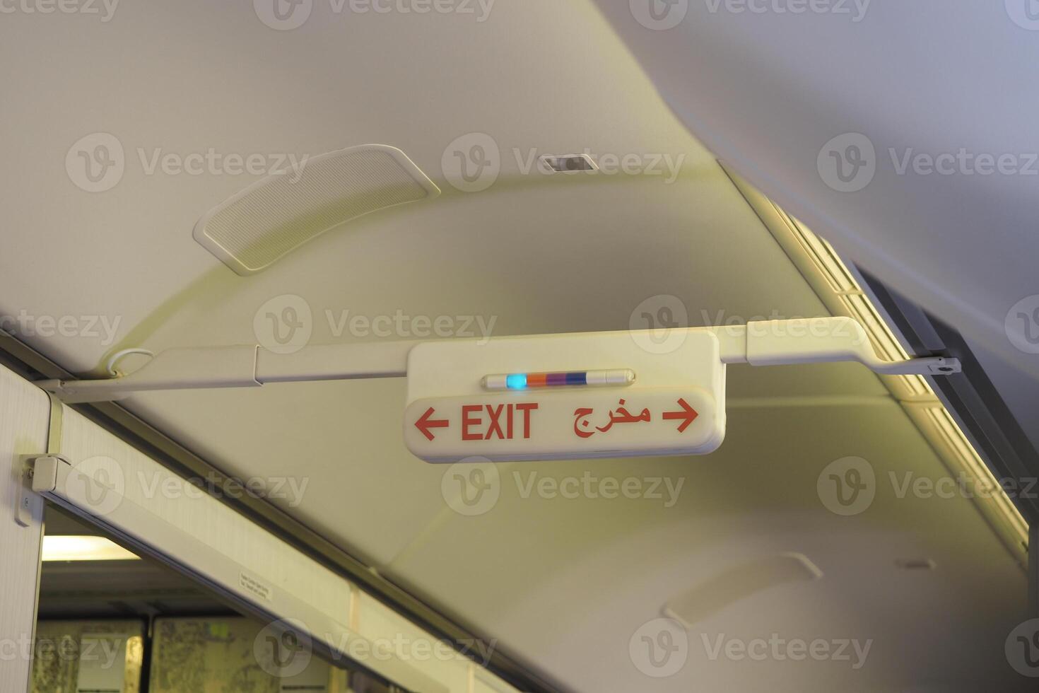 Sign indicating exit on an aircraft during flight photo