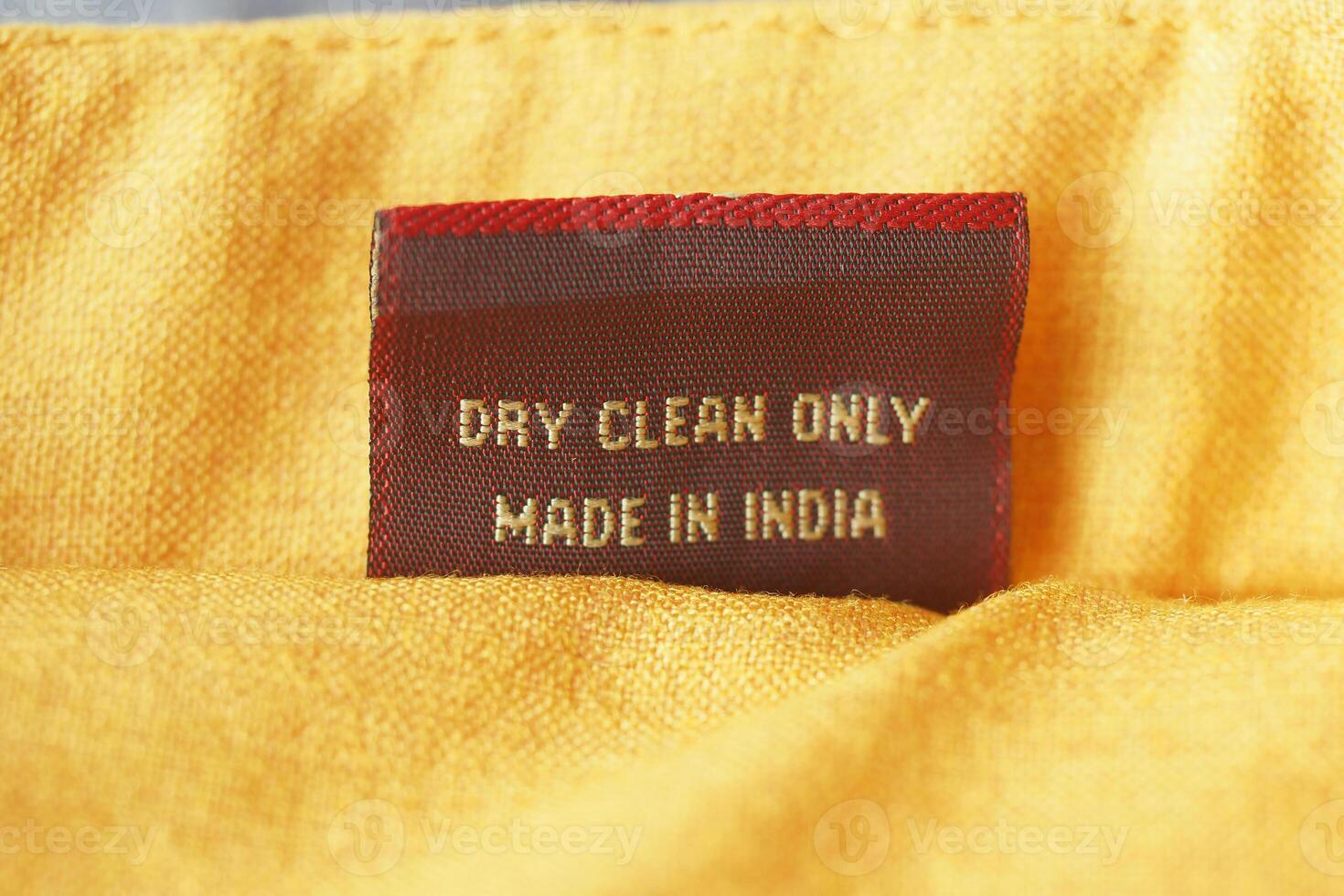 Care label showing dry clean instructions on fabric photo