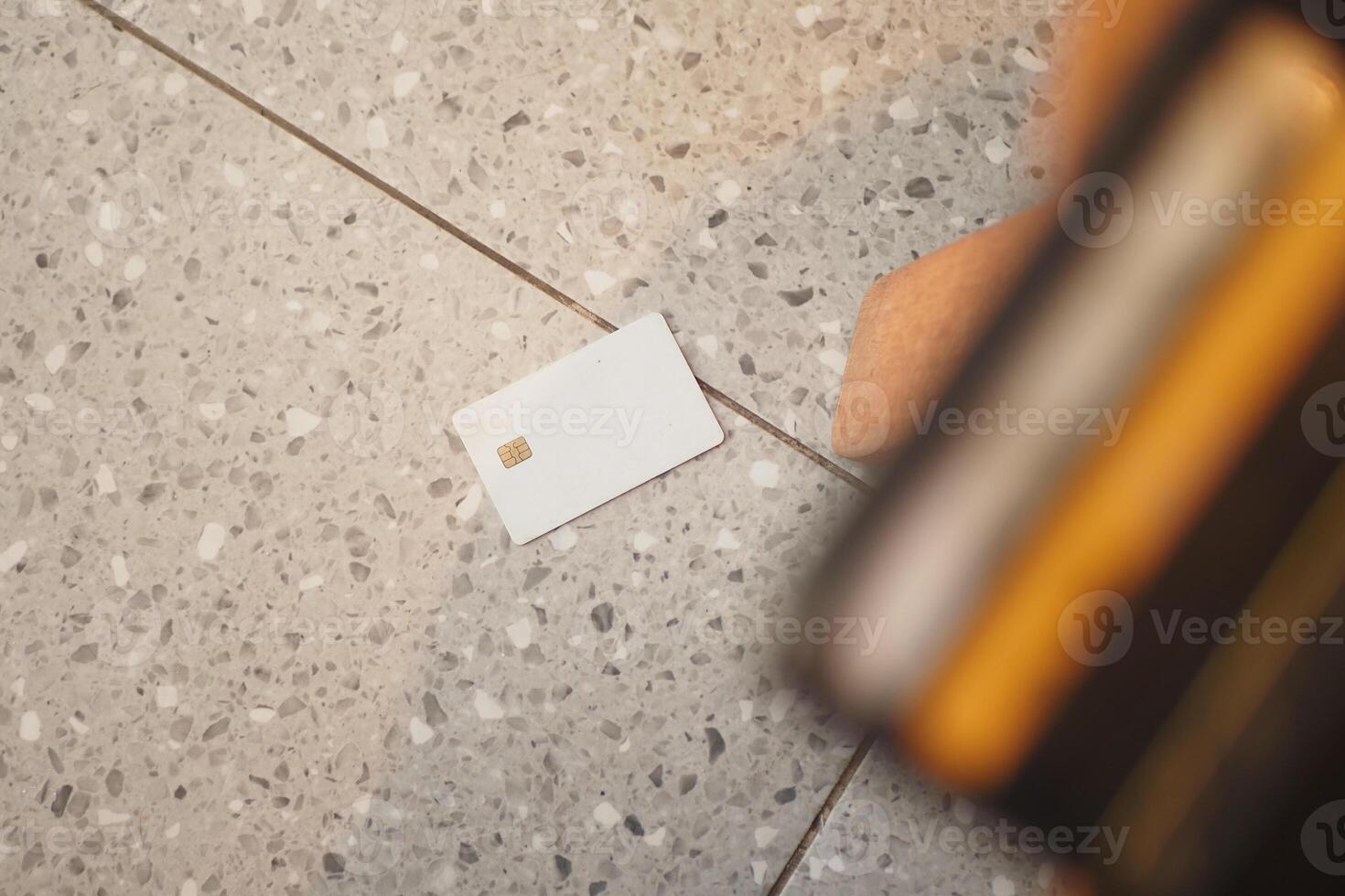 credit Card drops on floor, lost card concept photo
