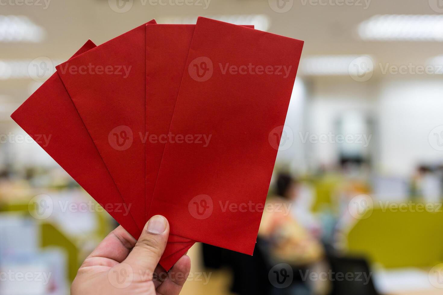 Man holding a red envelope photo