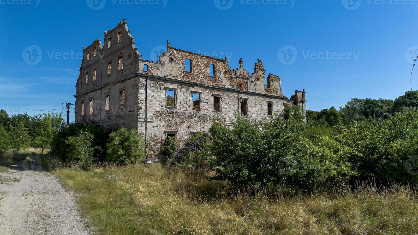 Half-ruined ancient castle, German building in Poland, Mietkow, Borzygnev, Drone view photo