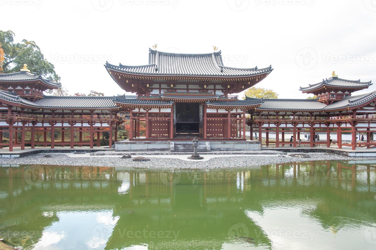Byodo-in Temple Uji Kyoto Japan, Historic temple complex reflecting in tranquil water. photo