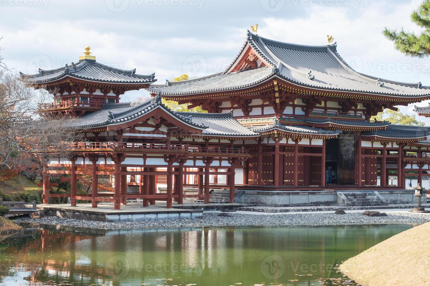 Byodo-in Temple Uji Kyoto Japan, Historic Japanese temple by a serene pond surrounded by nature. photo