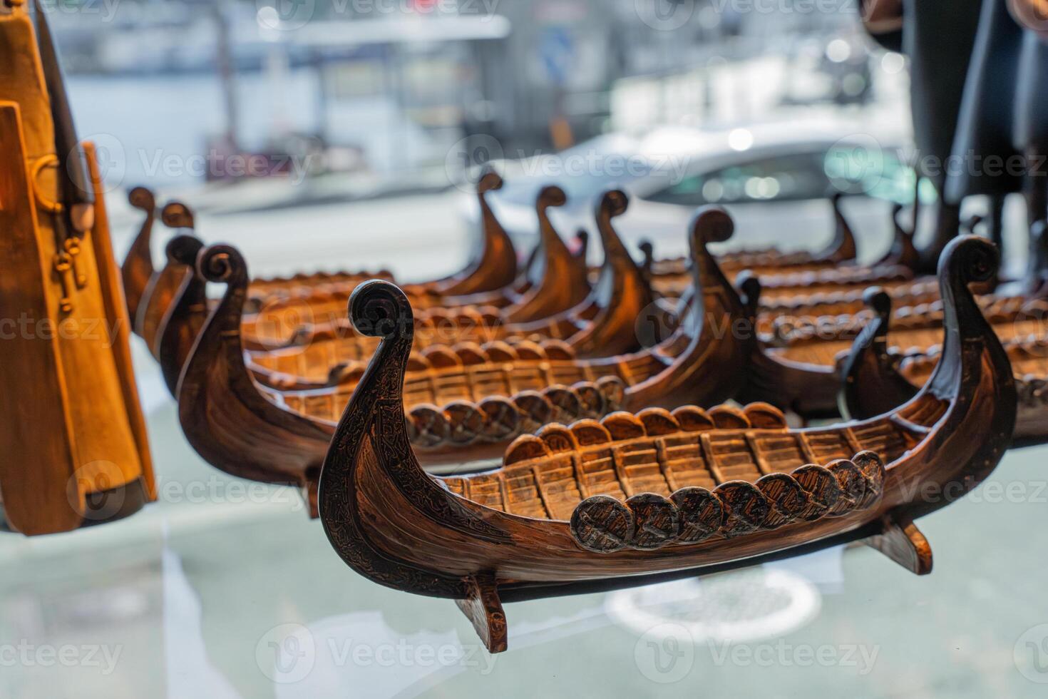 Wooden Viking longship souvenirs in window display of gift shop in Bergen Norway photo