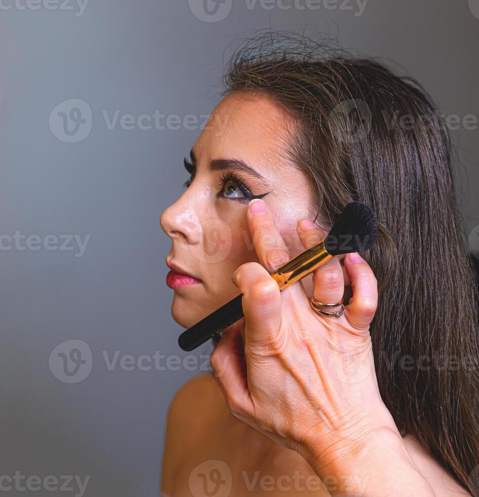 Radiant skin and bright red lips create a classic beauty look. She poses with elegance and grace photo