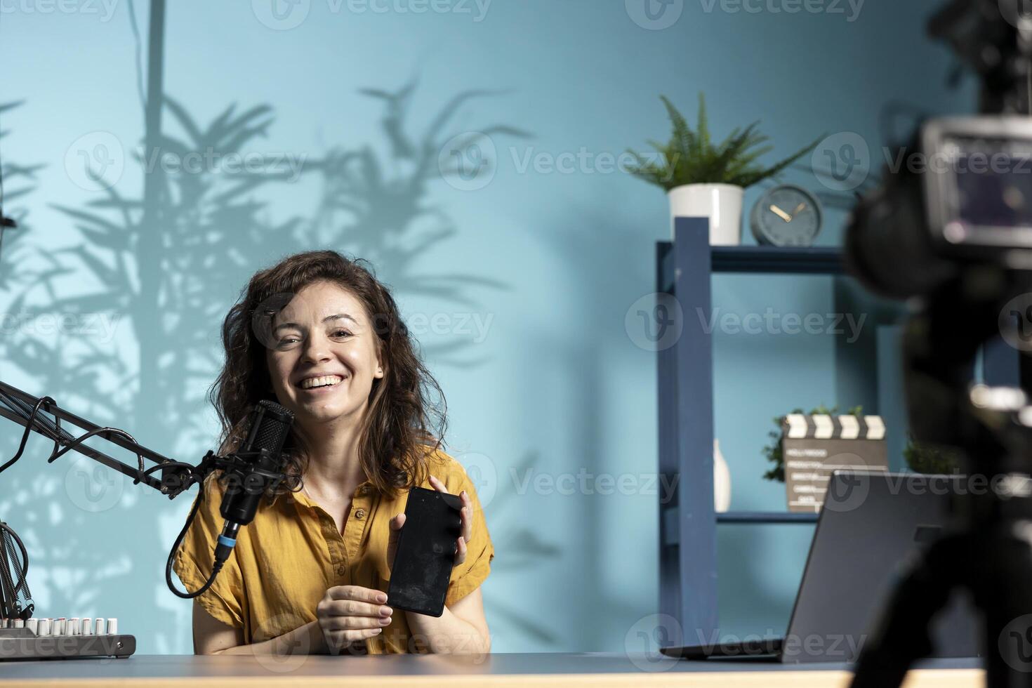 Content creator holding smartphone photo
