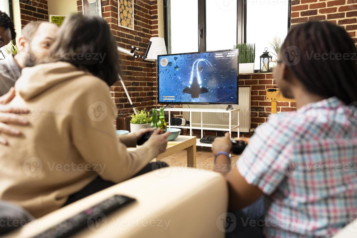 Friends gaming in cozy living room photo