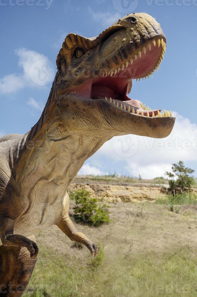 Huge Artificial dinosaur tyrannosaurus, close-up of dinosaur photo