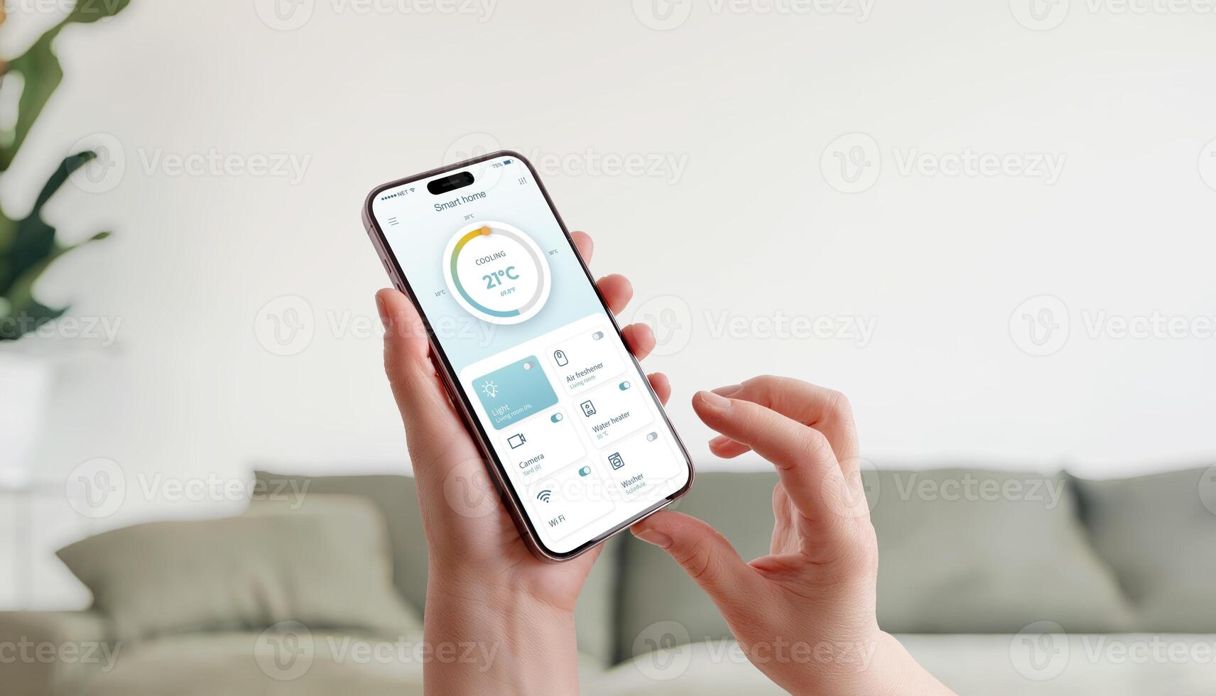 Smart home interface on smartphone showing temperature control and connected devices in cozy living space photo