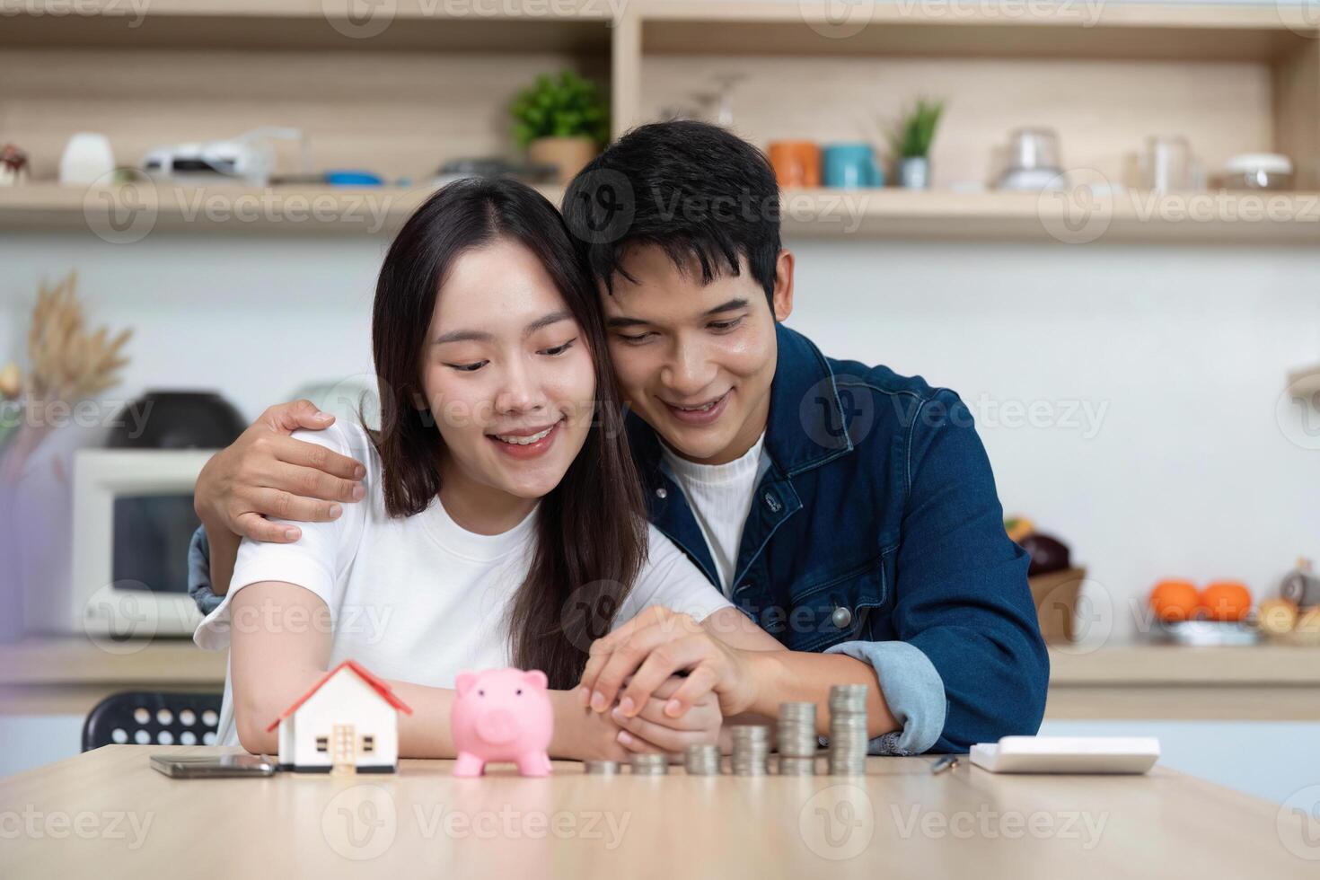 Couple Planning Future Together. Young partners celebrating financial milestones with savings. photo