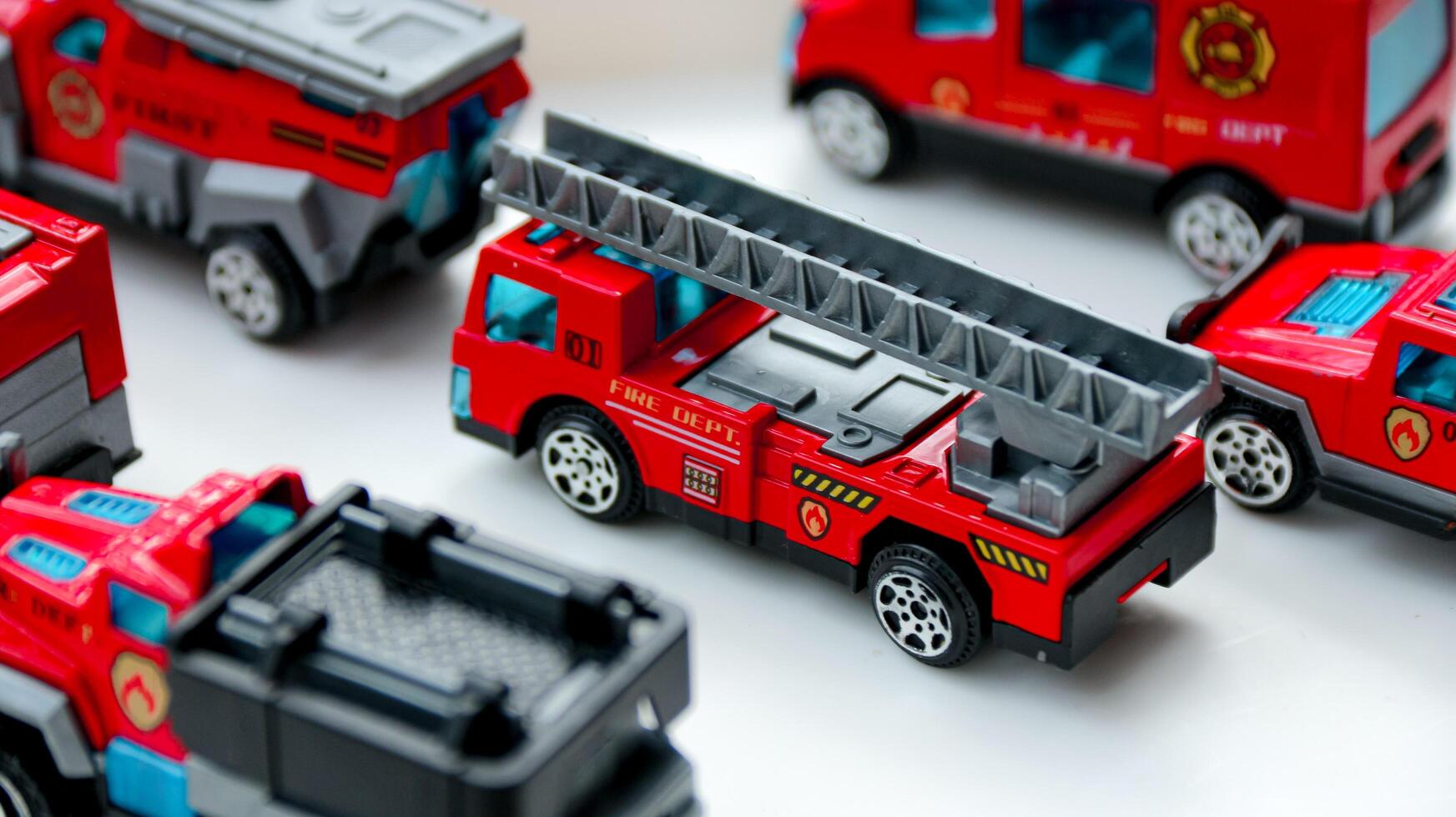 Toy Fire Trucks Collection on White Surface photo