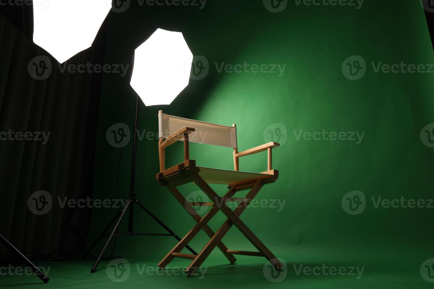 Chair of Film Director. Directors chair in green screen studio setup with softbox lighting. Ideal for filmmaking vdo production photo interviews and creative content with green chroma key background