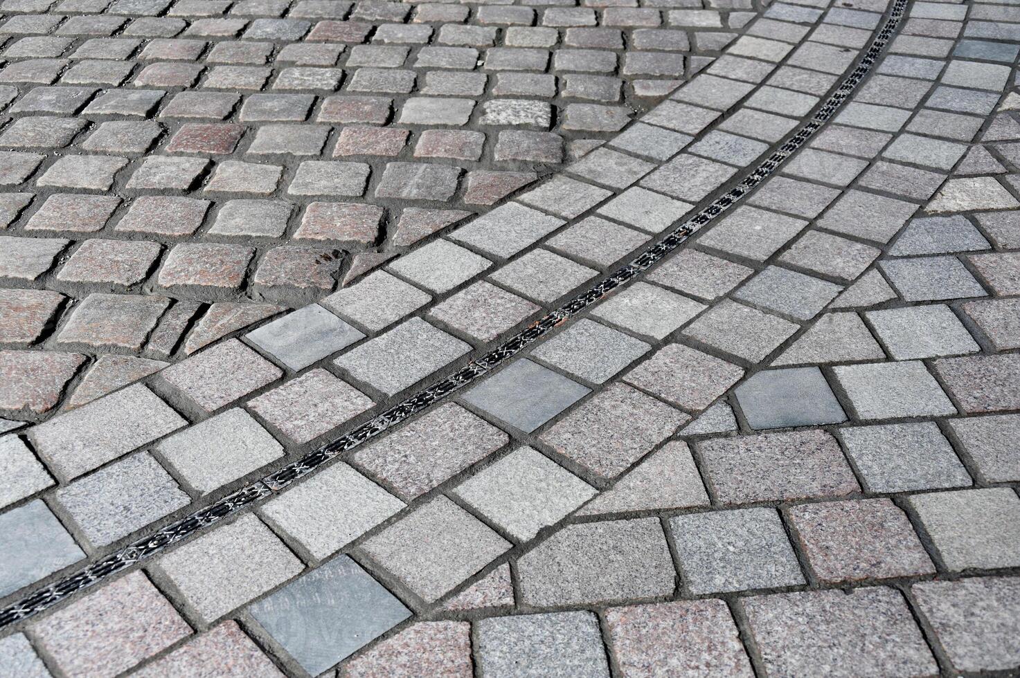 a street with a sidewalk and a curb photo