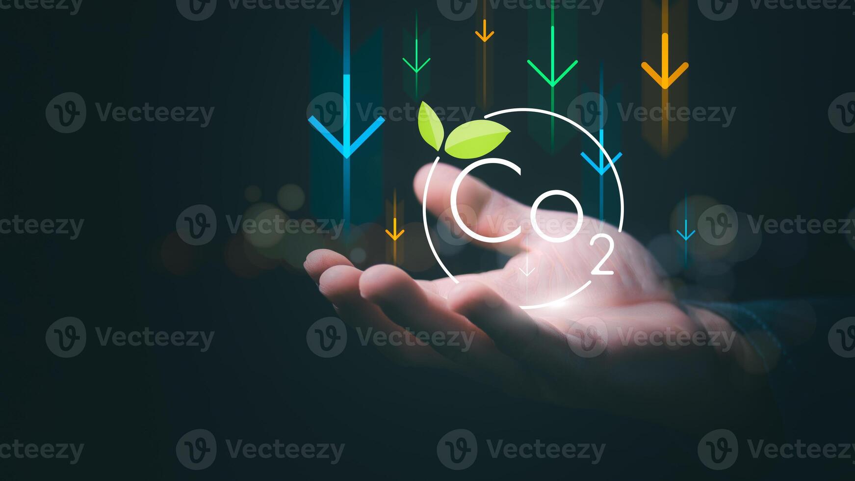 The concept of reducing global climate change, reducing global warming, a man is showing the reduction of CO2, which is the main cause of greenhouse gases and causes global warming. photo