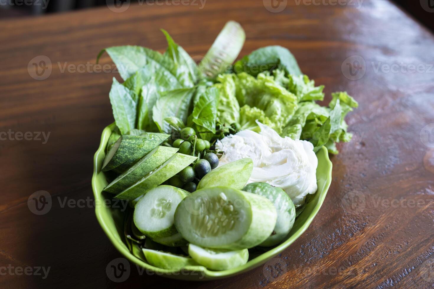 Lalapan or fresh raw vegetables authentic indonesian food photo