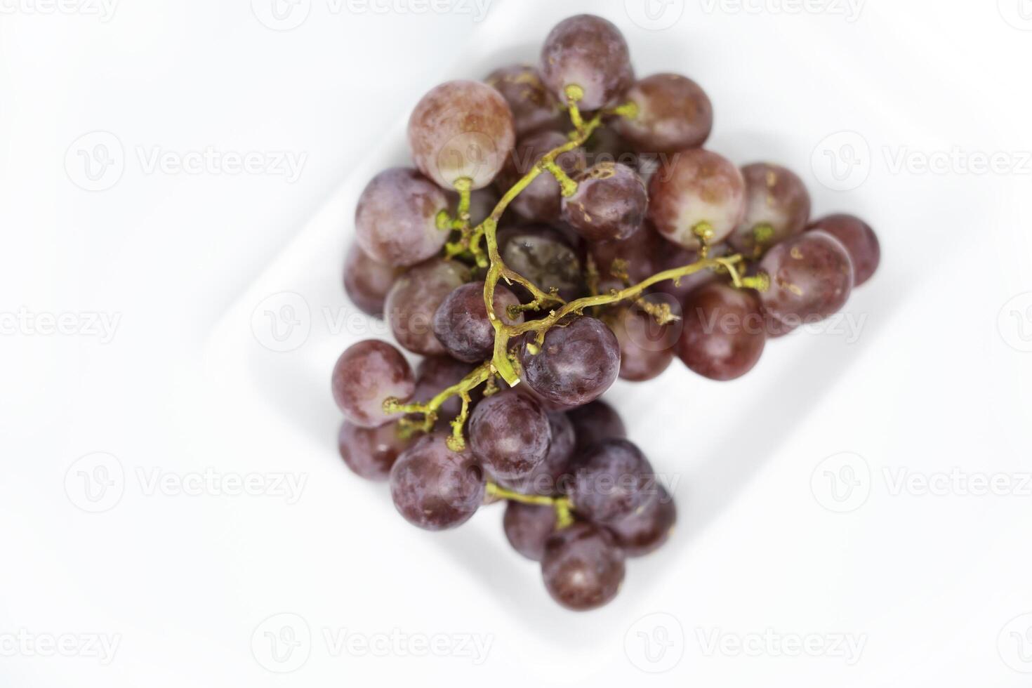 Red grapes being sell at fresh market isolated in white background photo