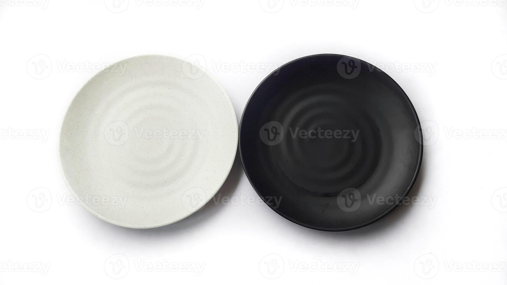 Empty circle white and black plates with ceramic melamin material isolated on white background photo