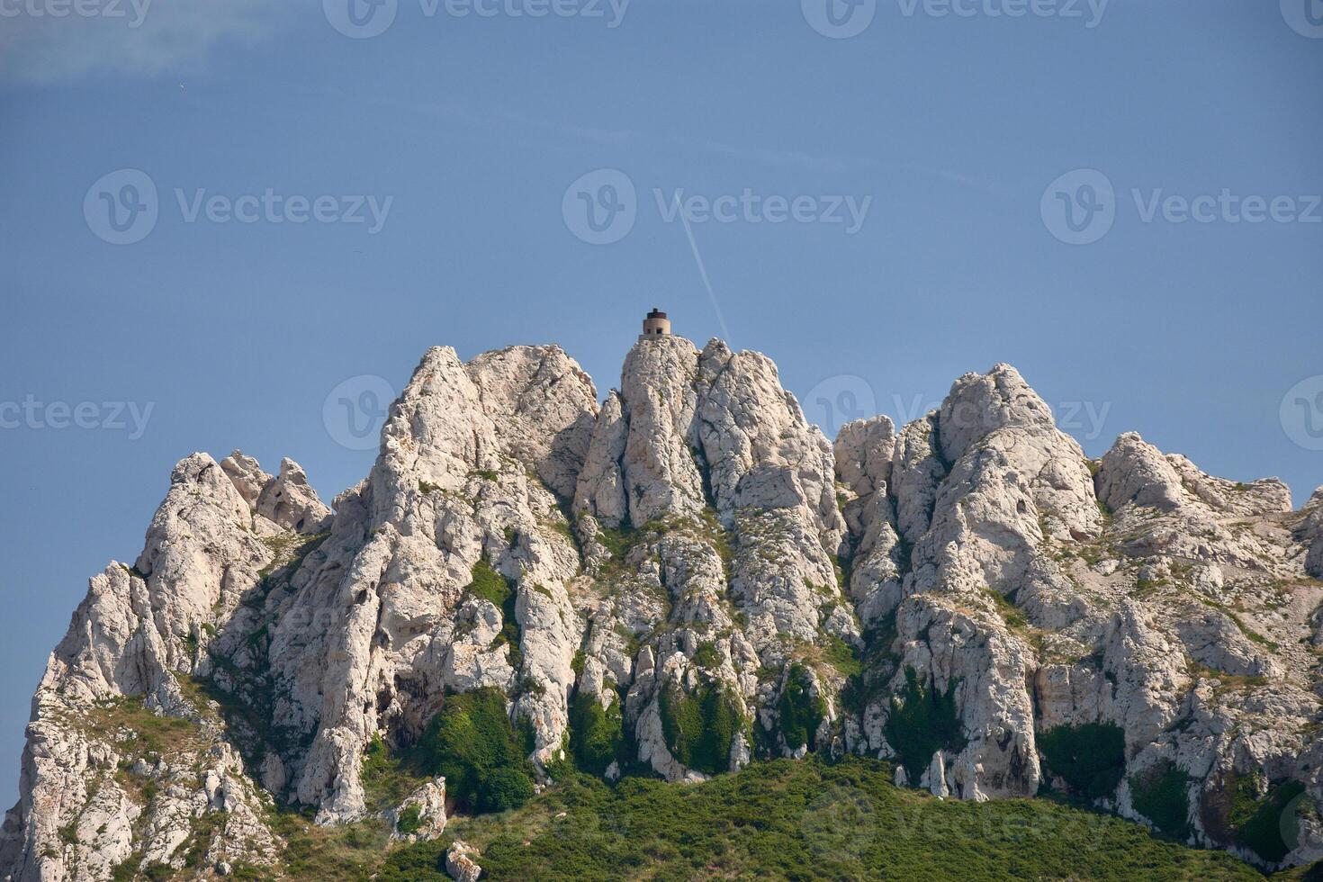 Sailing near the Calanques of Marseille, with white waves and coastal scenery in the sunlight photo