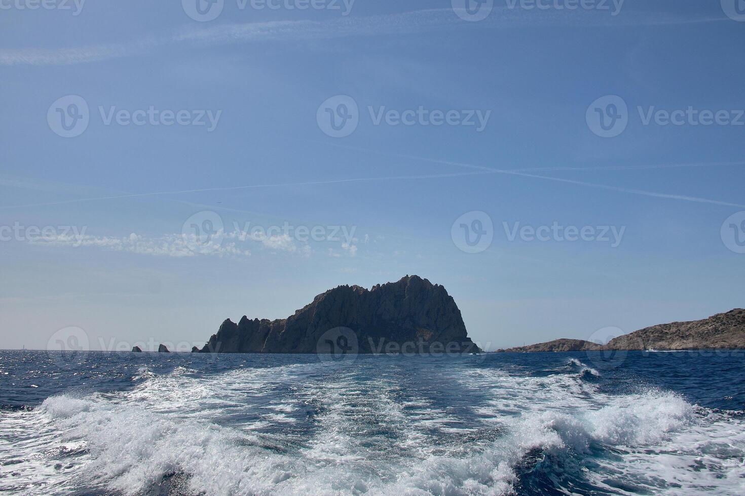 Sea foam and boat wake off the Calanques of Marseille Marseille on a sunny summer day photo