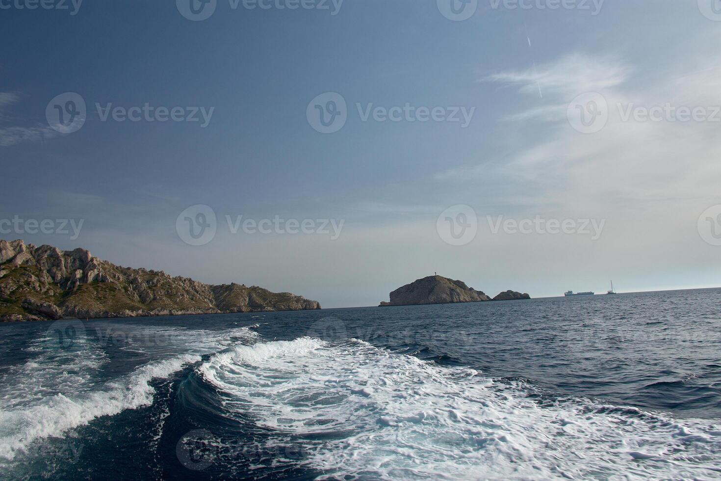 Sea and cliffs of the Calanques seen from a moving boat, ideal for trips and adventures in Provence photo