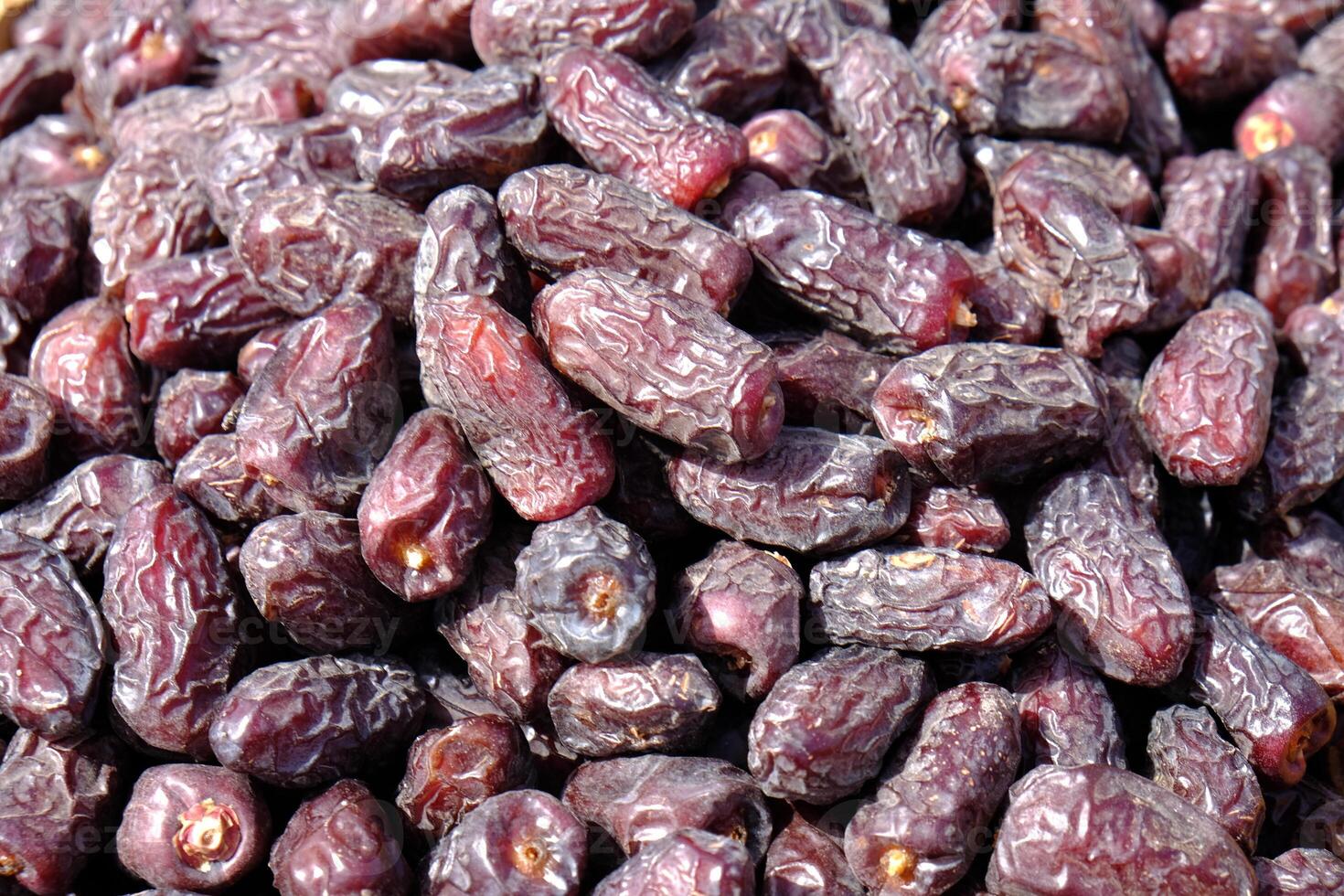 Bulk medjool palm dates at the market stall. photo